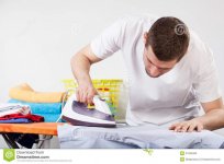 man-ironing-clothes-concentrated-shirt-41646365.jpg
