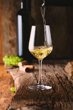 12600065-White-wine-pouring-in-a-glass.jpg